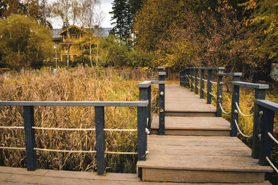 Empty pier in park during autumn