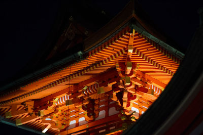 Low angle view of illuminated building at night