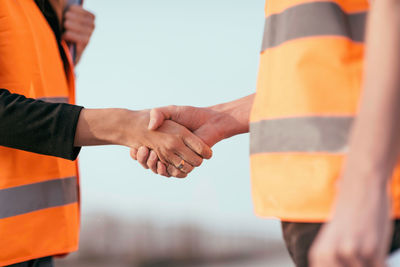 Close-up of engineers shaking hands