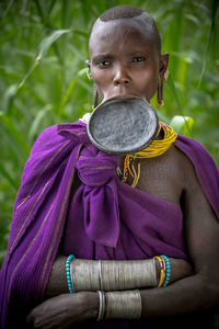 Portrait of woman standing outdoors