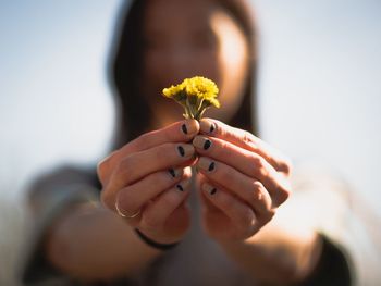 Close-up of holding flower outdoors