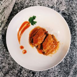 High angle view of fish served in plate on table