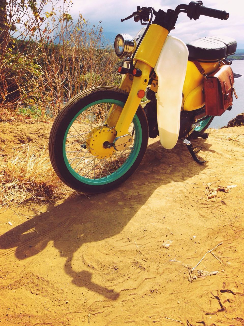 transportation, land vehicle, mode of transport, sand, bicycle, sunlight, beach, day, outdoors, car, wheel, stationary, road, street, leisure activity, field, lifestyles, shadow