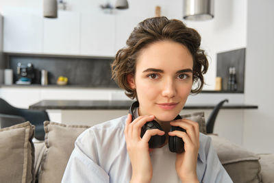 Close-up of young woman looking away