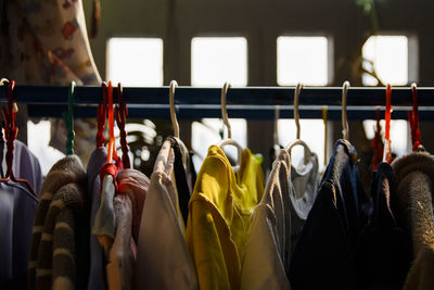 Clothes hanging on rack in store