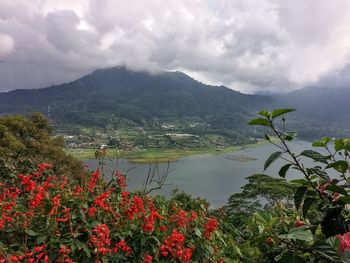 Scenic view of mountains against cloudy sky