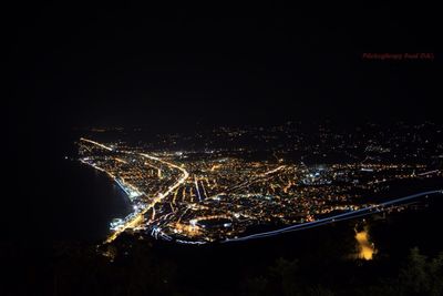 High angle view of illuminated city at night