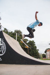 Young skateboarder jumping