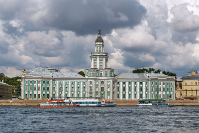 View of buildings against cloudy sky