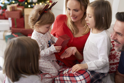 Family on bed at home