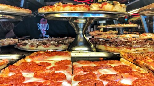 Close-up of pizza for sale at market stall