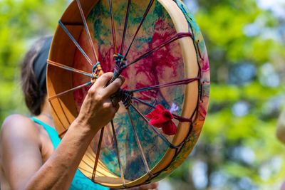 Close-up of person holding umbrella