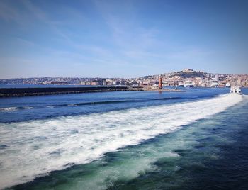 Scenic view of sea against blue sky