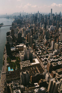 High angle view of modern buildings in city against sky