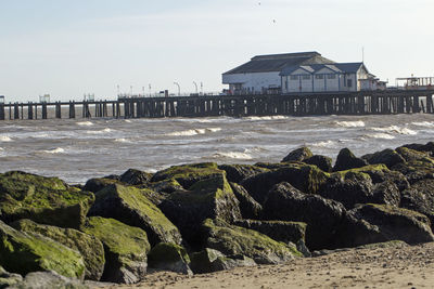 Scenic view of beach by sea against sky