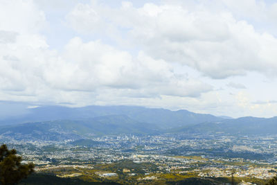 Aerial view of townscape against sky