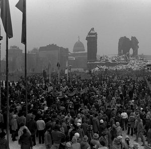 Panoramic view of crowd in city against sky