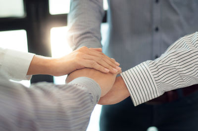 Midsection of couple hands