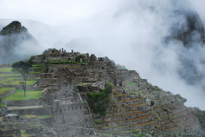 Scenic view of machu picchu in foggy weather