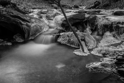 Rock formations in water with ice