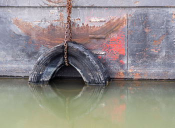 Reflection of old boat in lake