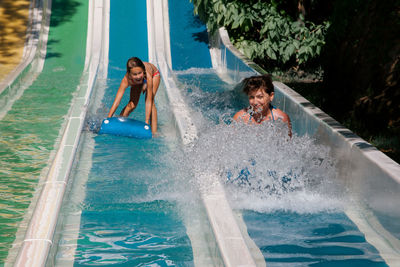 People enjoying in swimming pool