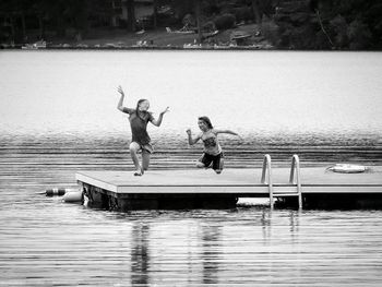 Boy jumping in swimming pool