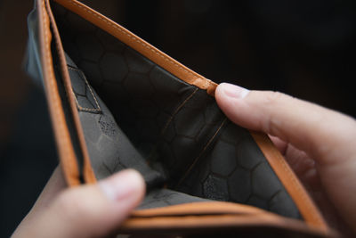 Close-up of person working on wood