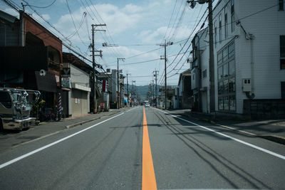 Road in city against sky