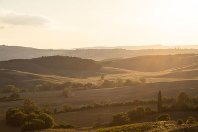 Scenic view of landscape and mountains against sky