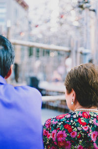 Rear view of man and woman outdoors