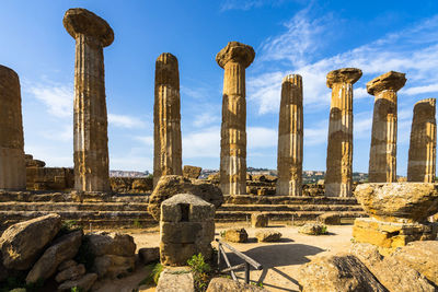 Doric columns of the temple of hercles at valle dei templi, agrigento, sicily, italy