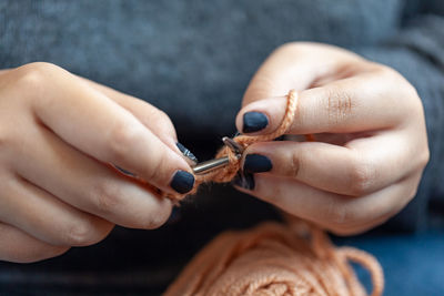 Close-up of woman holding hands