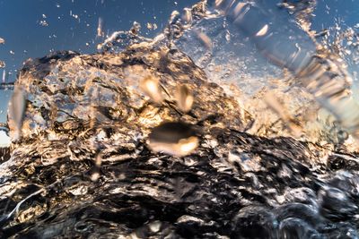 Close-up of water splashing on white background