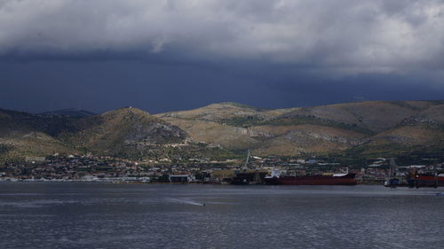 Scenic view of mountains against cloudy sky
