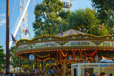 Low angle view of ferris wheel against clear sky