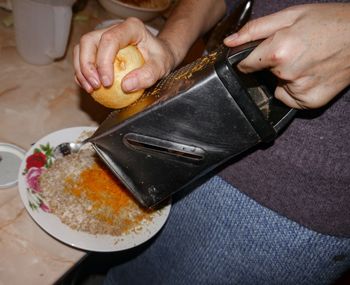 High angle view of man preparing food on table