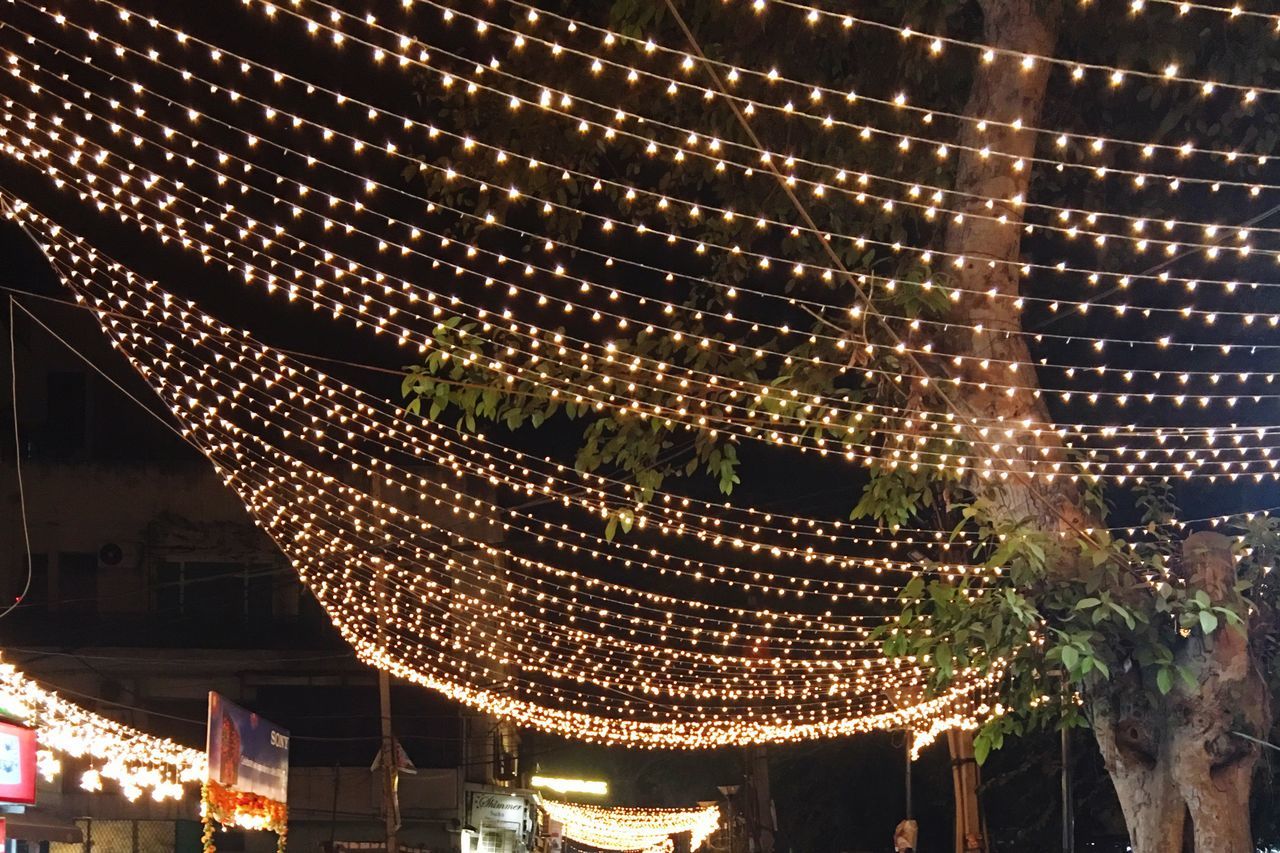 LOW ANGLE VIEW OF ILLUMINATED LIGHTING AT NIGHT