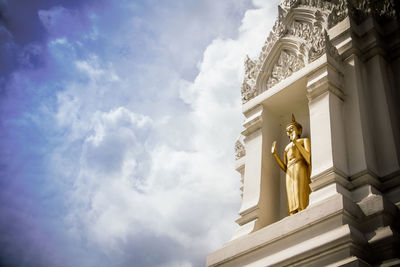 Thai buddha statue on sky background