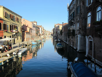 Boats moored in canal