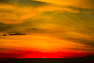 Low angle view of dramatic sky during sunset