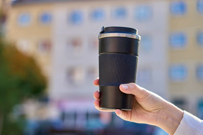 Close-up of hand holding camera