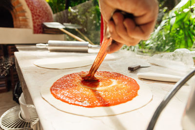 Close-up of hand holding cake