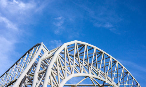 Low angle view of rollercoaster against sky