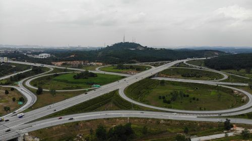 Aerial view of a intersection with a clover-leaf interchange