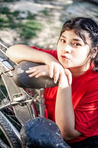 Portrait of happiness pretty beautiful chubby girl with red dress posing with vintage car.