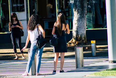 Full length of woman standing in city