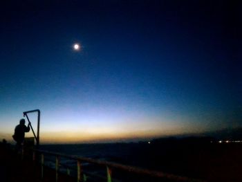 Silhouette of woman at night