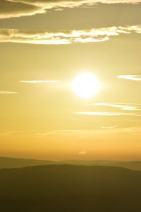 Sun shining through landscape