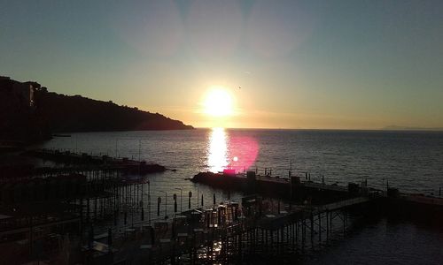 Scenic view of sea against clear sky during sunset